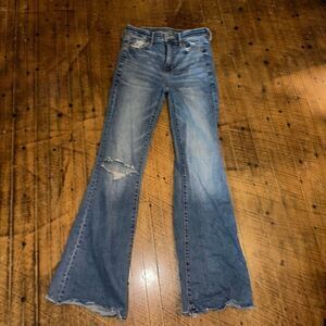 American Eagle distressed 0 hi-rise flare raw hem jeans